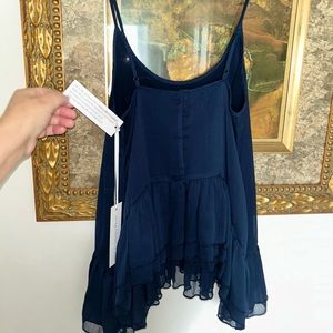 Beautiful Silky peplum, ruffled accent, navy top by Young Fabulous & Broke -sz S